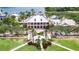 Aerial of community center featuring a well-manicured lawn, fountain, and ample parking at 204 Latitude Pl, Apollo Beach, FL 33572