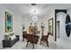 Bright dining area with seating for four, stylish decor, and plenty of natural light at 204 Latitude Pl, Apollo Beach, FL 33572