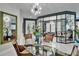 View of the dining room featuring a bright modern chandelier and stylish furniture at 204 Latitude Pl, Apollo Beach, FL 33572
