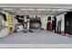 Spacious garage with epoxy flooring, ample storage, and organized shelving systems at 204 Latitude Pl, Apollo Beach, FL 33572
