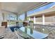 Enjoyable screened-in patio with comfortable seating and peaceful outdoor views at 204 Latitude Pl, Apollo Beach, FL 33572