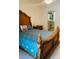 Beautiful bedroom with wooden furniture and adjacent bathroom at 4209 Amber Ridge Ln, Valrico, FL 33594