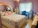 Bedroom featuring a colorful bed and desk area with natural light at 4209 Amber Ridge Ln, Valrico, FL 33594
