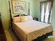 Bright bedroom featuring a four-poster bed with framed art and matching curtains at 4209 Amber Ridge Ln, Valrico, FL 33594