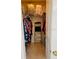 Walk-in closet with shelving, clothing, and storage bags on the upper shelf at 4209 Amber Ridge Ln, Valrico, FL 33594