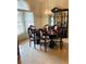 Formal dining room showcasing a grand hutch, chandelier, and seating for six at 4209 Amber Ridge Ln, Valrico, FL 33594
