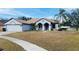Charming single-story home featuring a two-car garage, neutral stucco exterior and well-maintained lawn at 4209 Amber Ridge Ln, Valrico, FL 33594