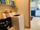 Convenient laundry area, offering washer and dryer hookups, and storage shelves at 4209 Amber Ridge Ln, Valrico, FL 33594