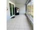Enjoy the screened in porch with tile floors and screened in windows to allow fresh air inside at 4209 Amber Ridge Ln, Valrico, FL 33594