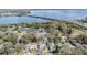 An aerial view of a neighborhood and the beautiful bridge and water in the distance at 2951 Bay View Dr, Safety Harbor, FL 34695