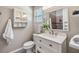 Bathroom with a white vanity, built in shelving and a shower at 2951 Bay View Dr, Safety Harbor, FL 34695