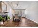 A spacious dining room featuring wood floors, a stylish fireplace, and lots of natural light at 2951 Bay View Dr, Safety Harbor, FL 34695