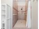 Tiled shower stall with grab bars and built in niche at 2951 Bay View Dr, Safety Harbor, FL 34695