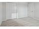 A light, airy bedroom with neutral carpet, double door closet, and access door, offering versatile space at 11127 Hudson Hills Ln, Riverview, FL 33579