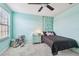 Stylish bedroom with a ceiling fan, plush carpeting, and cute decor at 11127 Hudson Hills Ln, Riverview, FL 33579