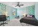 Stylish bedroom with a ceiling fan and cute decor at 11127 Hudson Hills Ln, Riverview, FL 33579