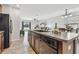 Bright, open kitchen featuring a sink with a view of the living room and backyard at 11127 Hudson Hills Ln, Riverview, FL 33579