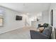 Bright loft area with neutral walls, plush carpeting, and comfortable seating, perfect for relaxing or entertaining at 11127 Hudson Hills Ln, Riverview, FL 33579