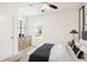 Bright bedroom with neutral decor, plush carpeting, and a window offering natural light, creating a soothing ambiance at 16949 Secret Meadow Dr, Odessa, FL 33556
