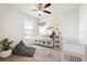 Playful room featuring a comfy bench, hot air balloon decor, and a white baby crib at 16949 Secret Meadow Dr, Odessa, FL 33556