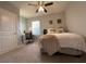 Comfortable bedroom with neutral walls, ceiling fan, and a plush bed at 16949 Secret Meadow Dr, Odessa, FL 33556