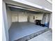 Two car garage offering plentiful storage space and a clean design ready for customization at 16949 Secret Meadow Dr, Odessa, FL 33556