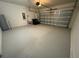Spacious garage with ample room for parking and storage, perfect for vehicles and organizational needs at 16949 Secret Meadow Dr, Odessa, FL 33556
