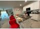 Eat-in kitchen featuring bar seating, white cabinets, granite countertops, and stainless steel appliances at 16949 Secret Meadow Dr, Odessa, FL 33556