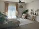 Cozy living room with a comfortable couch, natural light, and elegant decor elements at 16949 Secret Meadow Dr, Odessa, FL 33556