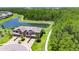 Aerial view of an elegant townhome with pond views and walking trail at 4899 Isola Ct, Wesley Chapel, FL 33543