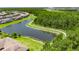 Aerial view of community pond and nature trail at 4899 Isola Ct, Wesley Chapel, FL 33543