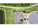 Overhead aerial view of the property showcasing landscaping, walkway, and proximity to a pond at 4899 Isola Ct, Wesley Chapel, FL 33543