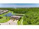 Aerial view of an elegant townhome with pond views and walking trail at 4899 Isola Ct, Wesley Chapel, FL 33543