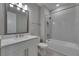 Bathroom featuring a shower and tub combination with a white single sink vanity at 4899 Isola Ct, Wesley Chapel, FL 33543