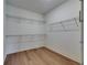 Spacious walk-in closet featuring wire shelving for storage and organization at 4899 Isola Ct, Wesley Chapel, FL 33543