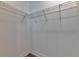Walk-in closet featuring wire shelving for optimal storage and organization at 4899 Isola Ct, Wesley Chapel, FL 33543
