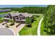 Aerial view of an elegant townhome with pond views and walking trail at 4899 Isola Ct, Wesley Chapel, FL 33543