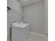 Bright laundry room featuring white appliances and wire shelving at 4899 Isola Ct, Wesley Chapel, FL 33543