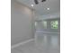 Open-concept space features neutral walls, tile floors, and natural light, perfect for modern living at 4899 Isola Ct, Wesley Chapel, FL 33543