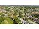 Aerial view showcases the neighborhood's lush landscaping and waterways at 8703 Driftwood Dr, Tampa, FL 33615