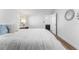 Bright bedroom with white walls, wood floors, and simple, elegant decor at 8703 Driftwood Dr, Tampa, FL 33615