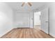 Bedroom featuring wood floors, bright white walls, and closet at 8703 Driftwood Dr, Tampa, FL 33615