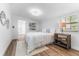 Bright bedroom featuring a comfortable bed, ample natural light, and minimalist decor at 8703 Driftwood Dr, Tampa, FL 33615