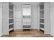 Spacious walk-in closet with custom shelving and drawers for organized storage solutions at 8703 Driftwood Dr, Tampa, FL 33615