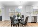 Eat-in dining space with natural light and updated chandelier at 8703 Driftwood Dr, Tampa, FL 33615