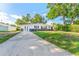 Charming single-story home with a well-maintained lawn and spacious driveway at 8703 Driftwood Dr, Tampa, FL 33615