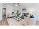 Bright living room featuring modern furnishings, stylish decor, and a ceiling fan at 8703 Driftwood Dr, Tampa, FL 33615
