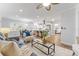 Open-concept living space with updated kitchen, hardwood floors, and stylish decor at 8703 Driftwood Dr, Tampa, FL 33615