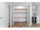 Well-organized pantry with shelving and a beverage cooler for optimal storage and convenience at 8703 Driftwood Dr, Tampa, FL 33615