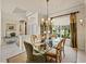 Formal dining room featuring a glass table and elegant decor at 12700 Grand Traverse Dr, Dade City, FL 33525